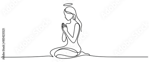 Woman with praying hands and halo sits in meditation