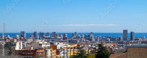 Cityscape of Barcelona's El Poblenou neighborhood with modern buildings facing the sea