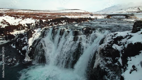 Iceland Waterfall in winter from above, slow moving