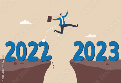 Happy new year 2023 hope for business success, new year resolution or opportunity, motivation and work enjoyment concept, happy businessman jump cross the gap from year 2022 to 2023.