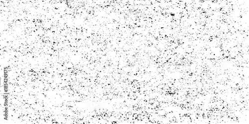 Vintage abstract grunge background featuring a textured black and white design with a rough stone surface and dirty paper pattern on a gray concrete wall backdrop