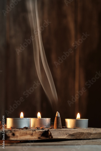 Candles and Incense Produce Smoke in a Simple Indoor Setting