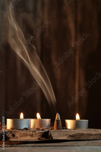 Candles and Incense Produce Smoke in a Simple Indoor Setting