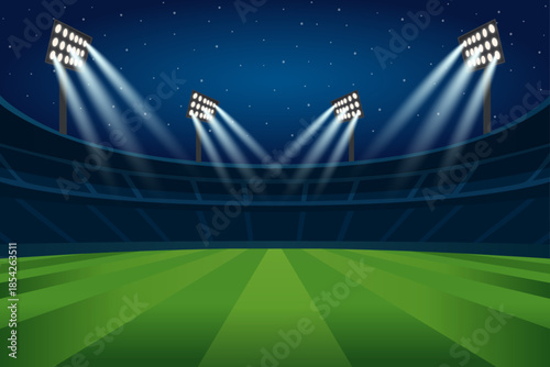 Night stadium with glowing floodlights and green field