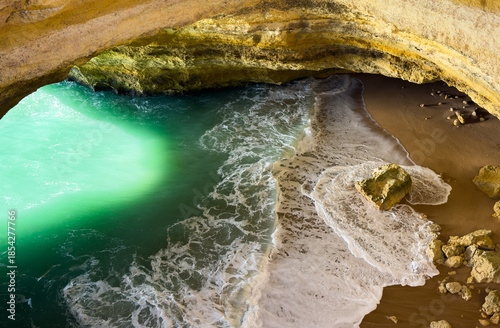 Corredoura Beach, sighted viewpoint on the trail of the Seven Suspended Valleys (Sete Vales Suspensos). Praia da Corredoura with flying seagulls near Benagil village, Algarve, Portugal.