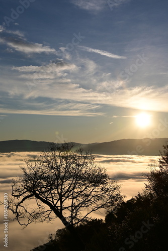 Stunning sunrise from a mountain top over the clouds