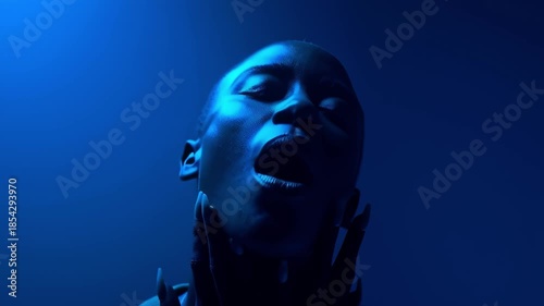 Young black woman expressing herself on blue background