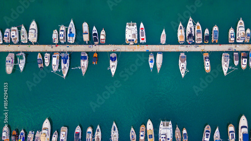 Photos Top-down view of a marina with boats and docks