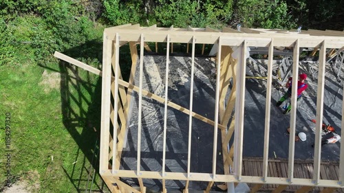 Building a Structure Using Wood and Tools in a Green Area