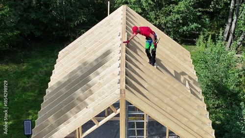 Building a Roof on a Wooden Structure in a Green Area