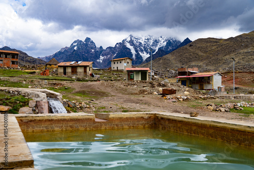 Fotografie Pacchanta hot springs with a view of the Ausangate snow-capped mountain, Cusco,