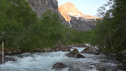 Flowing River and Mountain View in Norway During Morning Light