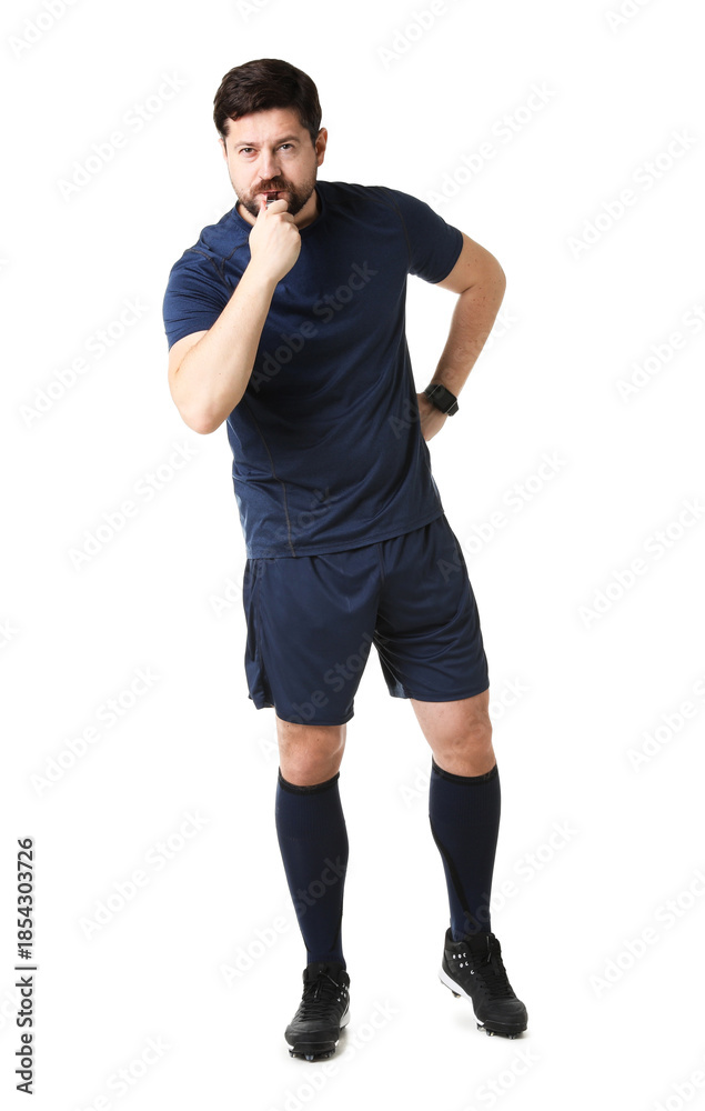 Fototapeta premium Referee in uniform blowing whistle on white background