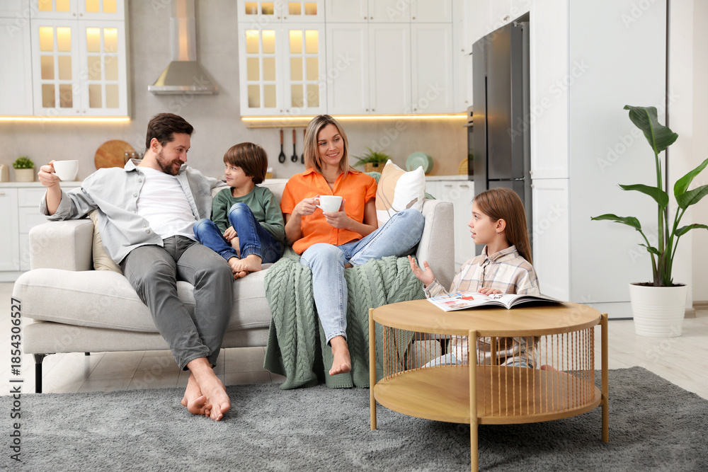 Fototapeta premium Happy family spending time together in kitchen at home