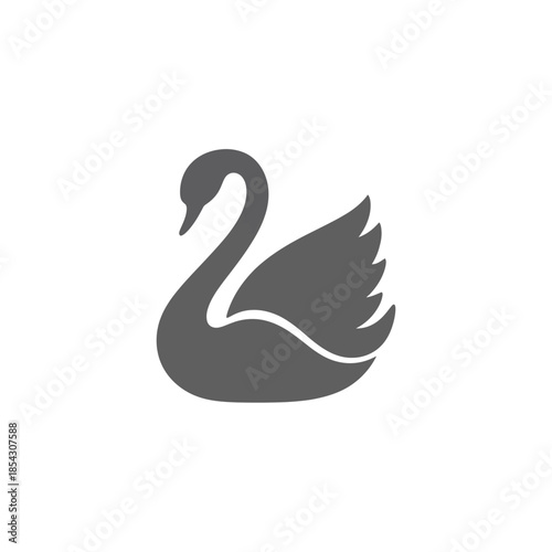 Elegant swan silhouette gracefully gliding across the water a symbol of beauty.