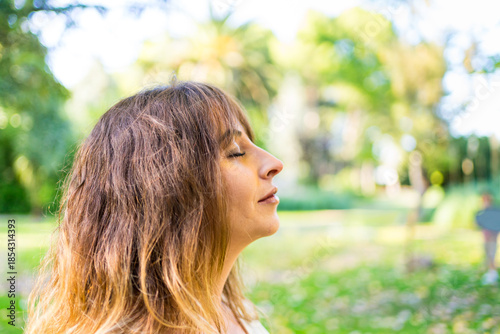 Profile portrait of a woman with her eyes closed