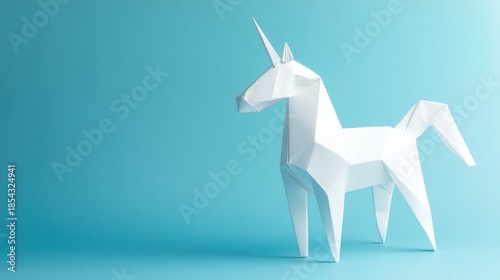 A white origami unicorn stands against a plain blue background viewed from the side
