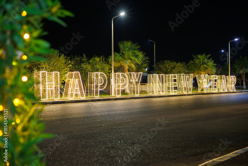 Bild auf Leinwand Illuminated happy New Year sign on street