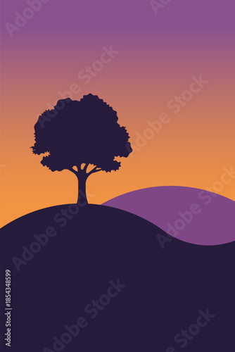 Silhouette of a lone tree on a hill against a vibrant gradient sunset sky