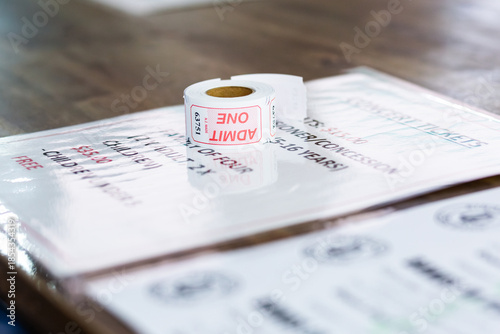 Admit one seat ticket roll on desk at music concert