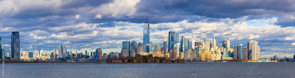 Fototapeta premium Lower Manhattan skyline across New York Harbor with Freedom Tower, NYC