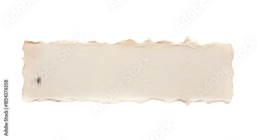 A single piece of vintage textured paper with rough torn edges isolated on a black background