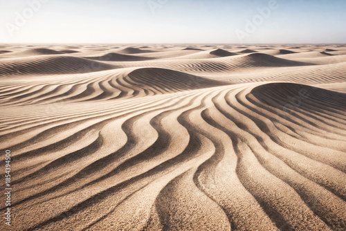 Aerial View of Rippled Sand Dunes in Vast Desert Landscape