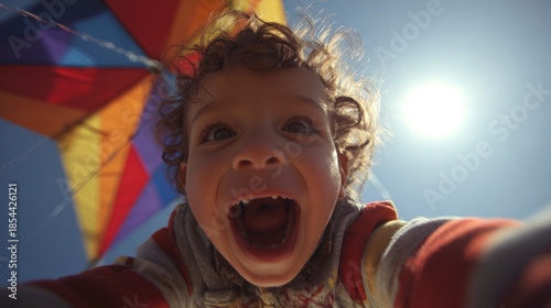 Child playing with kite outdoors