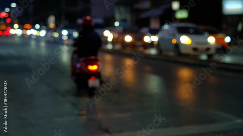 Wallpaper Mural A blurry image of a busy street at night with cars and traffic lights. Scene is busy and chaotic, with the cars and traffic lights creating a sense of movement and activity Torontodigital.ca