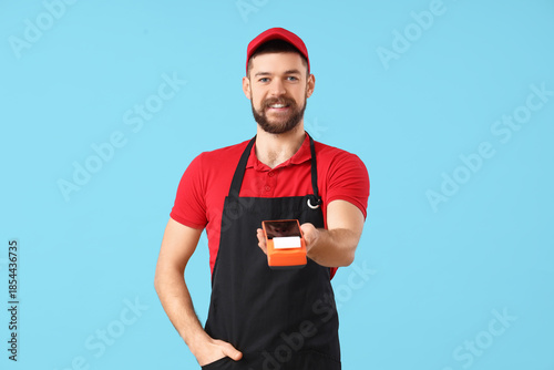 Male cashier with payment t...