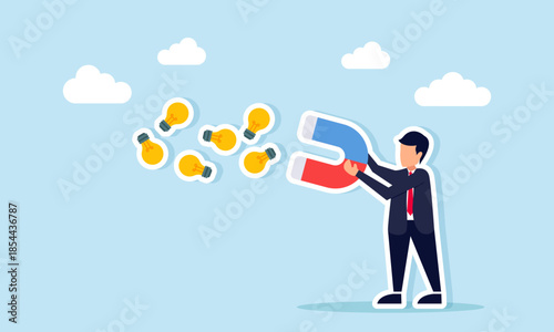 Businessman uses a magnet to attract many light bulbs showing efforts to collect ideas and boost business innovation