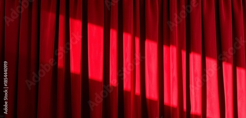 Deep burgundy velvet curtain backdrop, rich folds and shadows,  background,  burgundy background