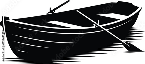 Silhouette of a rowboat floating on water