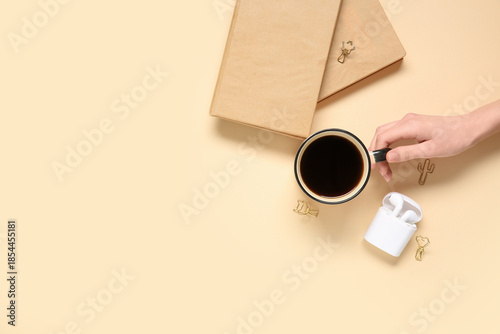 Female hand with cup of cof...