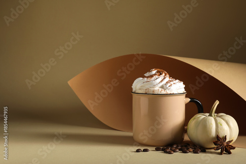 Mug of pumpkin latte with w...