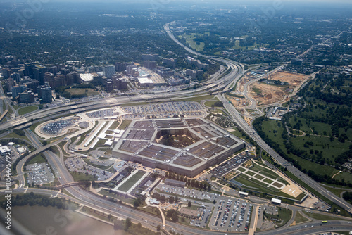 Aerial view of the Pentagon complex with surrounding roads, parking and greenery. g.