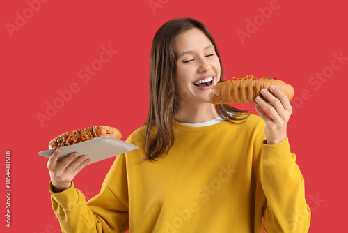 Young woman with tasty hot ...