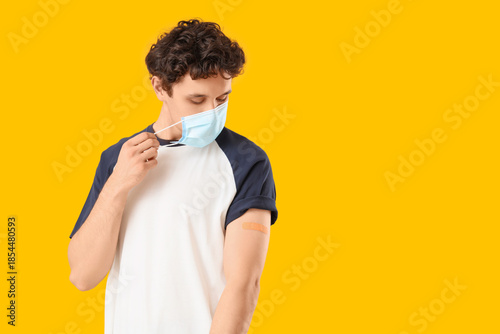 Young man in medical mask a...