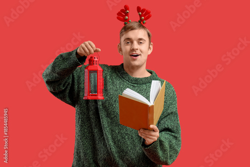 Young man with lantern and ...