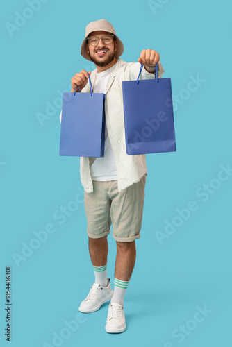 Stylish young man with shop...