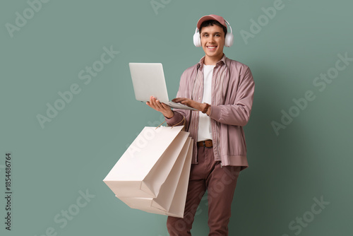 Young man in headphones wit...