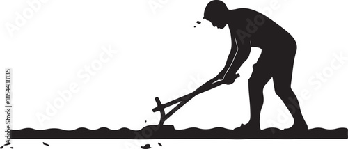 Silhouette of a farmer or agricultural worker manually plowing a field, illustrating traditional farming, cultivation, and hard labor in agriculture or land tilling