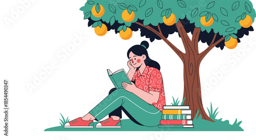 A happy young woman sits under a fruit tree, peacefully reading a book with a stack of more books beside her in a park setting.