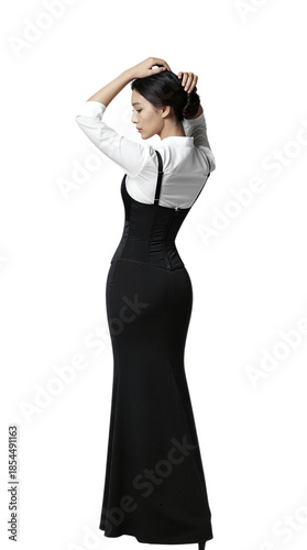 Woman in black dress and white shirt posing