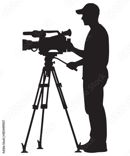 Silhouette of a professional cameraman operating a video camera on a tripod