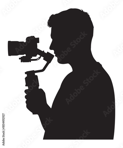 Silhouette of a professional videographer operating a handheld camera gimbal for filmmaking