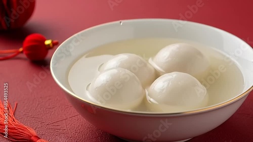Tang Yuan Ginger Soup Being Served, Traditional Chinese Rice Ball Dessert in Motion