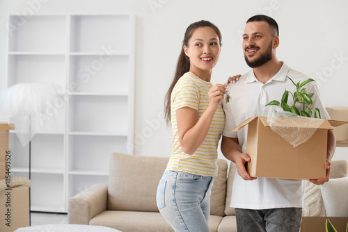 Young couple with key from ...