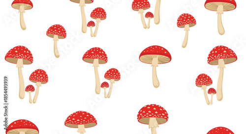 A seamless pattern of red and white spotted toadstool mushrooms, also known as fly agaric, on a clean white background design.