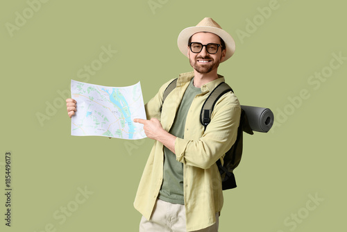 Young male tourist with map...